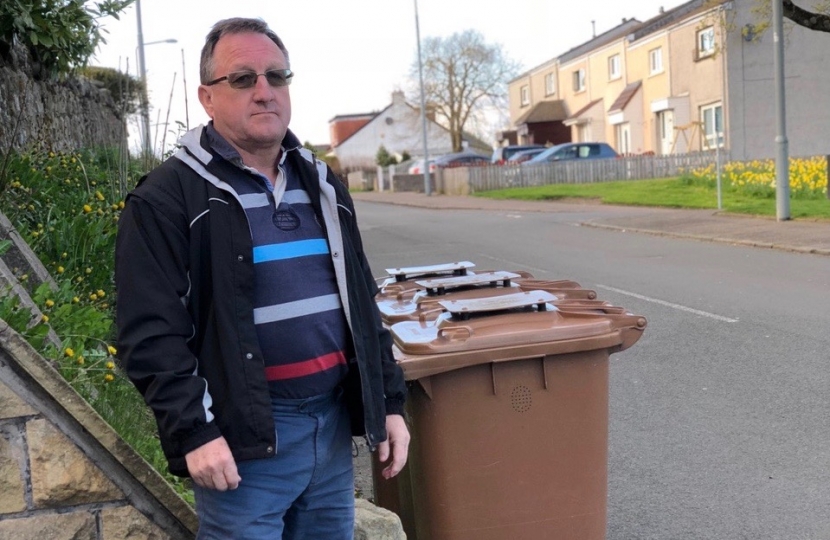 Charles Kennedy getting to grips with the bins